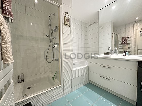 Bathroom equipped with washing machine, dryer, cupboard