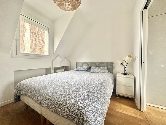 Bedroom with wooden floor