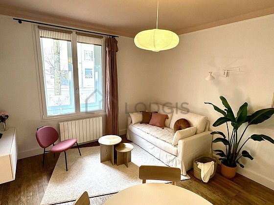 Living room furnished with tv, 1 armchair(s), 1 chair(s)