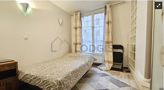 Bedroom with tile floor