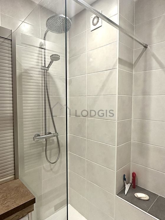 Bathroom equipped with washing machine, bath towels
