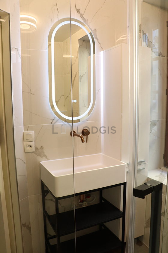 Bathroom equipped with hair-dryer