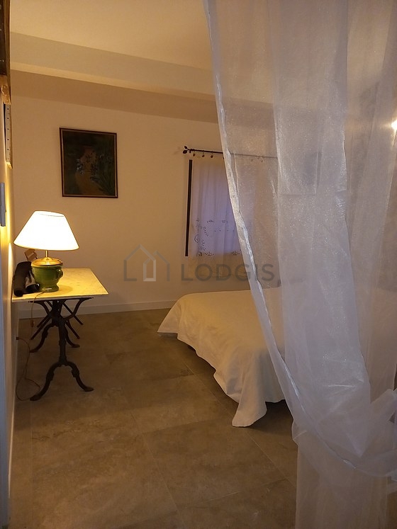 Bedroom with tile floor