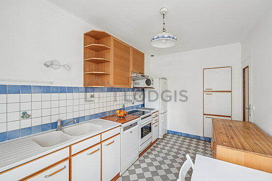 Kitchen equipped with washing machine, kettle
