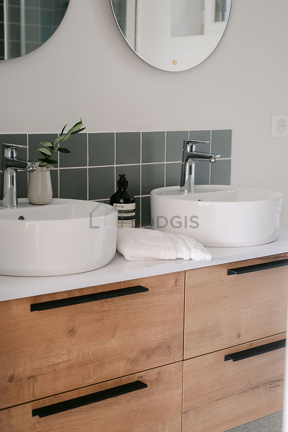 Bathroom equipped with washing machine, dryer