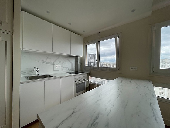 Kitchen equipped with dishwasher, refrigerator, crockery