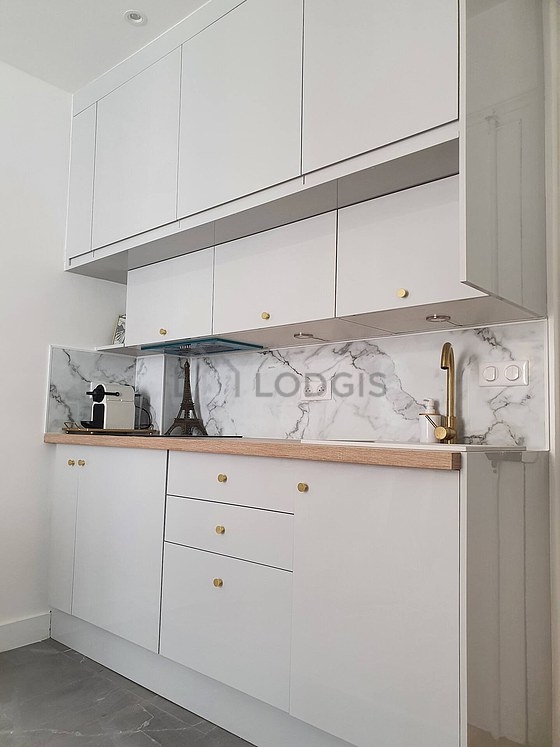 Kitchen equipped with coffee-maker
