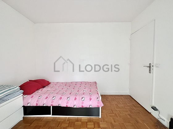 Bedroom with windows and balcony