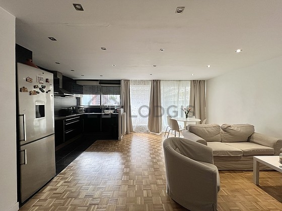 Living room with windows and balcony