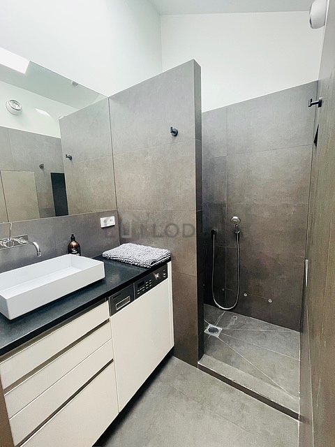 Pleasant and very bright bathroom with tile floor