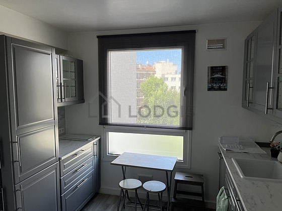 Kitchen equipped with washing machine, refrigerator