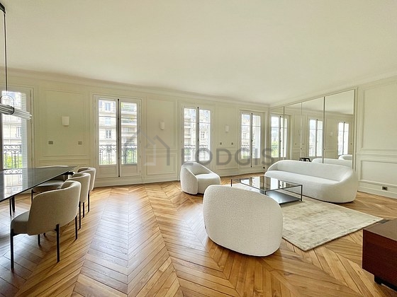 Living room with double-glazed windows and balcony facing the road