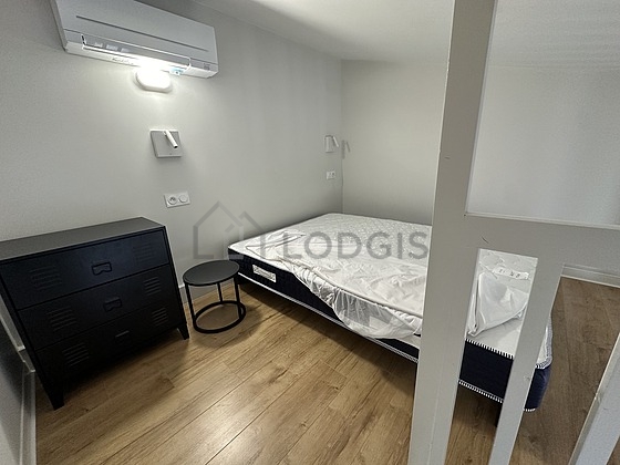 Bedroom with wooden floor