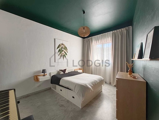 Bedroom with wooden floor