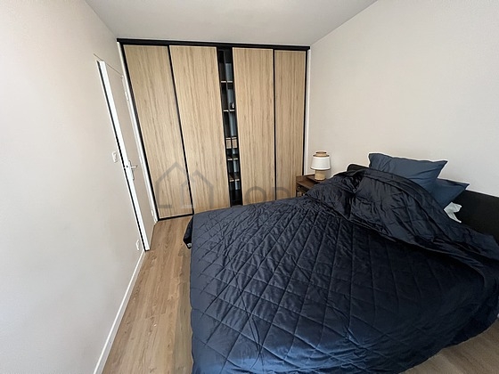 Bedroom with wooden floor