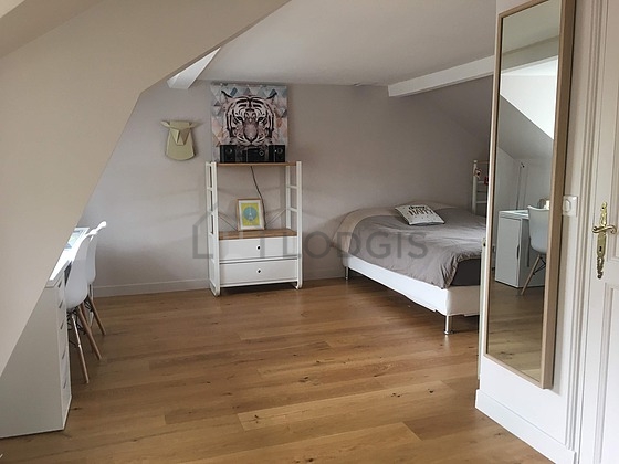 Bedroom with wooden floor