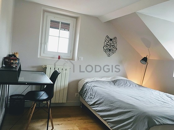Bedroom with wooden floor