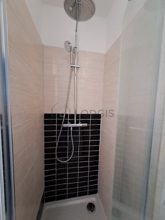 Bathroom equipped with separate shower, towel drying radiator