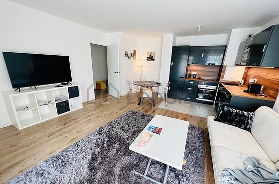 Quiet living room furnished with tv, 1 chair(s)