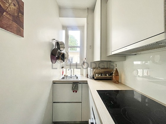 Kitchen equipped with washing machine, refrigerator, freezer, extractor hood