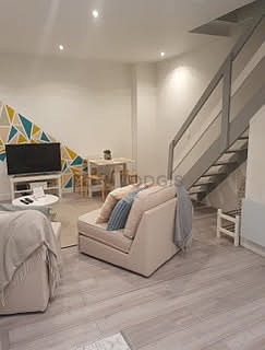Living room of 18m² with wooden floor