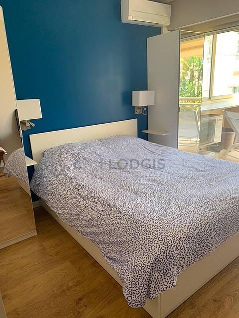 Bedroom with wooden floor