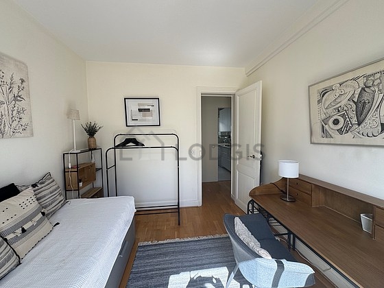Bedroom with windows and balcony facing the road