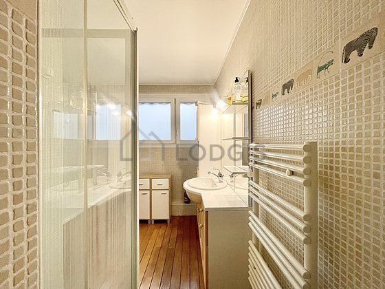 Bathroom equipped with bath tub, separate shower, towel drying radiator