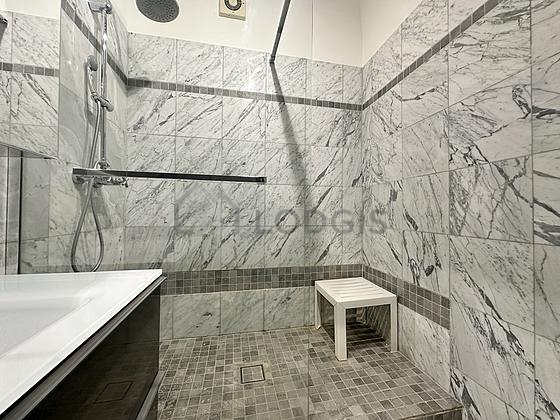 Bathroom equipped with washing machine, bath towels