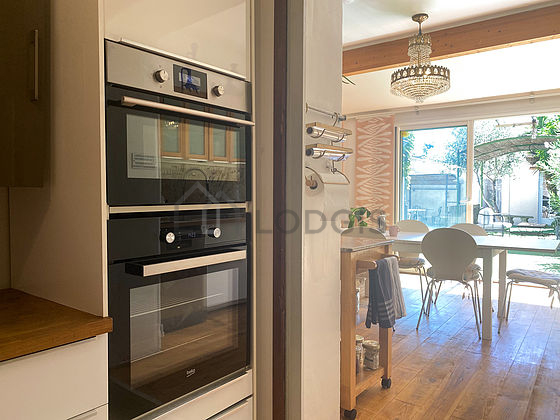 Kitchen equipped with washing machine, refrigerator, freezer
