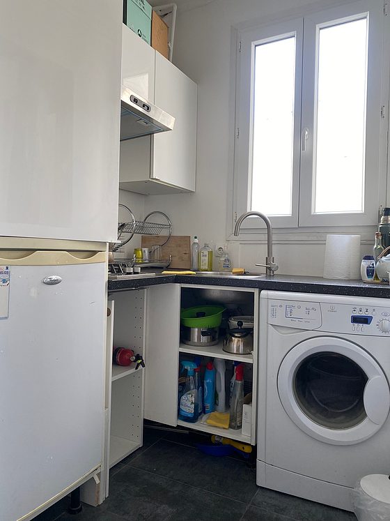 Kitchen equipped with washing machine, refrigerator, freezer