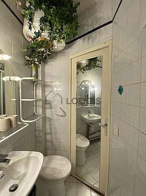Bathroom equipped with separate shower, electric toilet