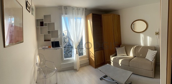 Living room furnished with sofa, coffee table, 1 chair(s)