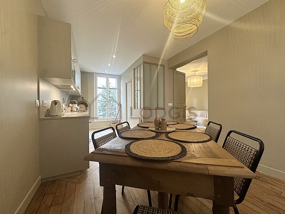 Kitchen equipped with dishwasher, refrigerator, crockery