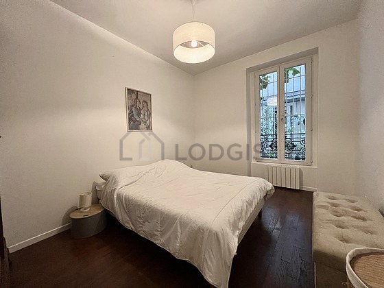 Bedroom with wooden floor