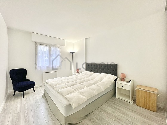 Chambre de 14m² avec du parquet au sol