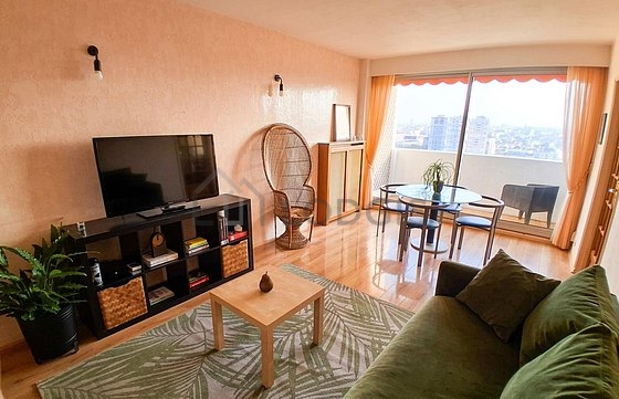 Quiet living room furnished with tv, 1 armchair(s), 2 chair(s)