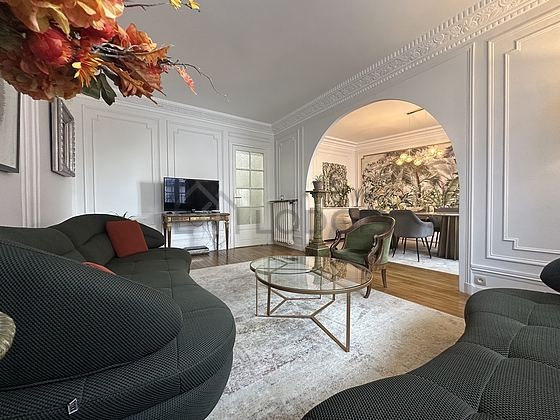 Quiet living room furnished with tv, 1 armchair(s)