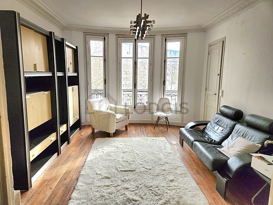 Quiet living room furnished with tv, cupboard