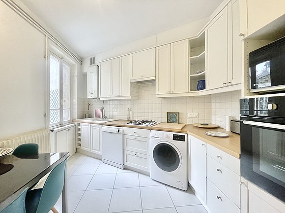 Kitchen equipped with washing machine, dryer, refrigerator, freezer