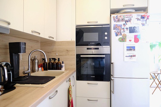 Kitchen equipped with washing machine, refrigerator