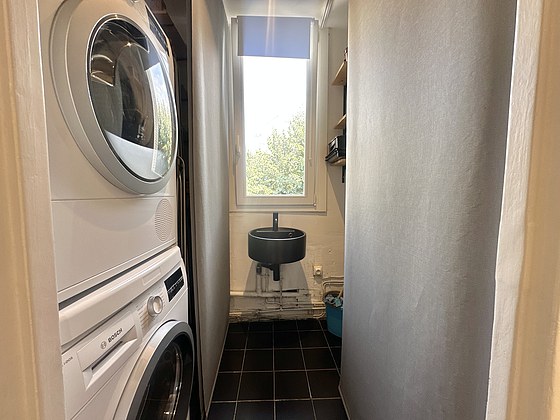 Laundry room with tile floor and equipped with washing machine, dryer