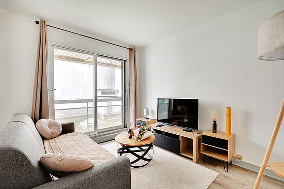 Séjour équipé de 1 canapé(s) lit(s) de 140cm, télé