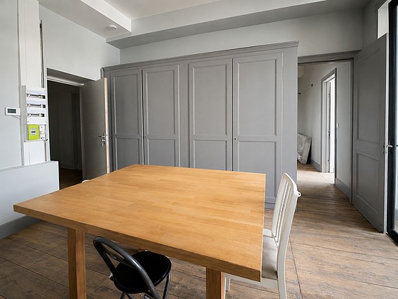 Kitchen equipped with hob, refrigerator