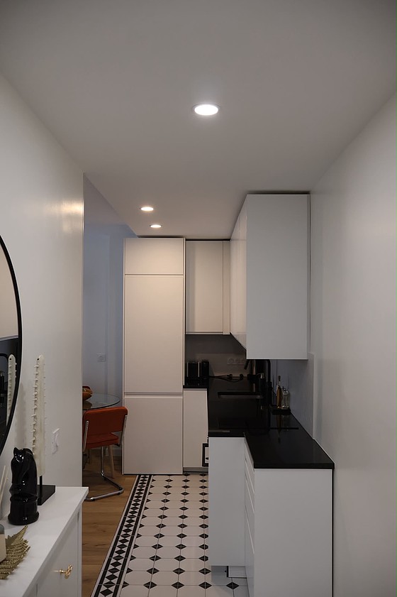 Kitchen equipped with washing machine, refrigerator, freezer