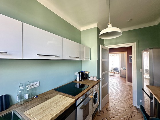 Kitchen equipped with washing machine, refrigerator