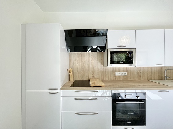 Kitchen equipped with washing machine, dryer, refrigerator, freezer