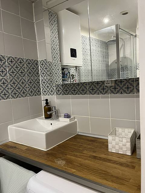 Bathroom equipped with washing machine, dryer