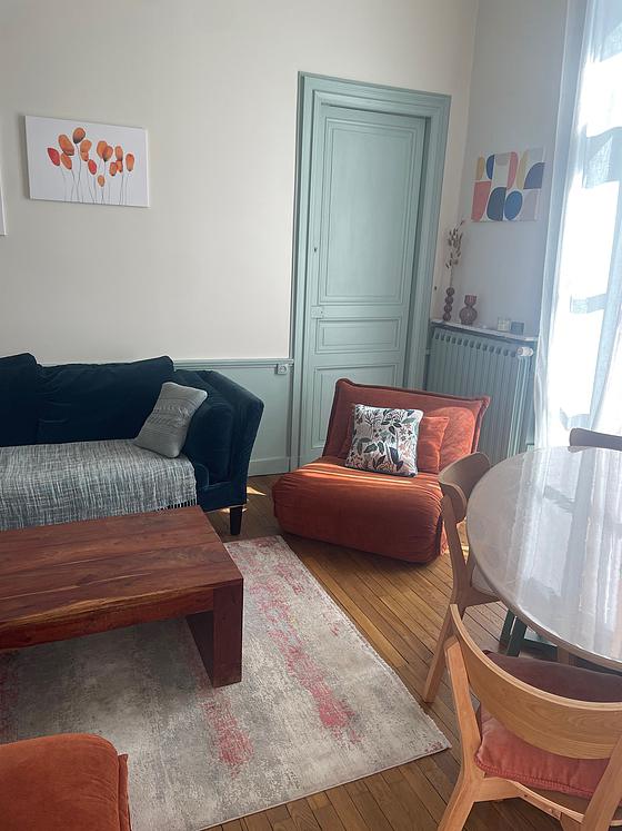 Living room furnished with sofa, coffee table, 1 chair(s)