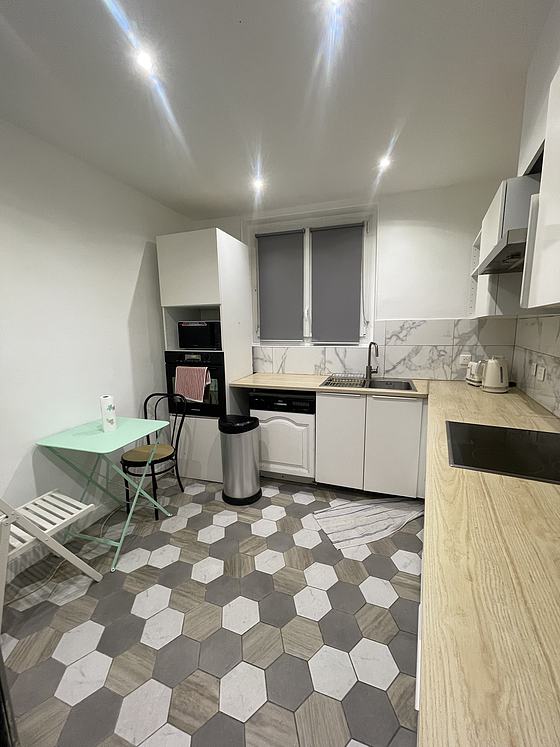 Kitchen equipped with dishwasher, hob, refrigerator
